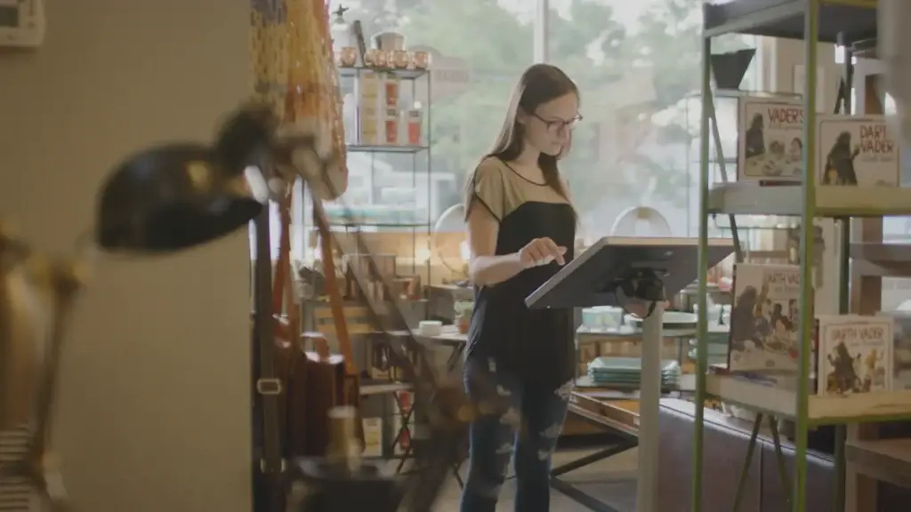 Female shopper using a kiosk in a brick and mortar store