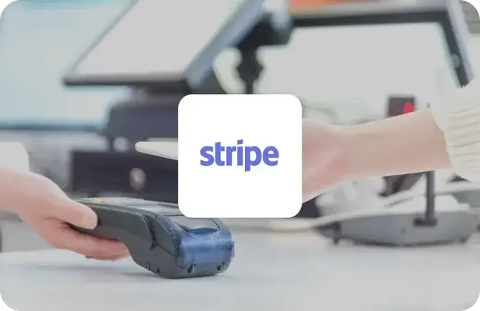 Stripe logo on a white card over hands tapping a card on a retail payment terminal